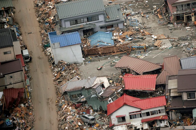 Destroyed houses and debris rest after earthquake